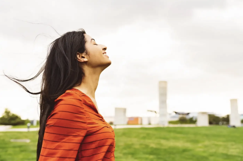 south asian woman is taking a breath of fresh air in Antwerp